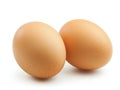 Two brown eggs sit next to each other on a white background Royalty Free Stock Photo