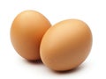 Two brown eggs sit next to each other on a white background Royalty Free Stock Photo