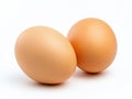 Two brown eggs sit next to each other on a white background Royalty Free Stock Photo