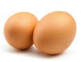 Two brown eggs sit next to each other on a white background Royalty Free Stock Photo