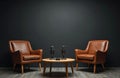 Two brown leather armchairs and microphones are set up in an empty studio room. This space is ready for interviews or podcast Royalty Free Stock Photo