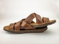 Two brown leather fashion sandals. Close up on the white background. Royalty Free Stock Photo