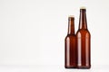 Two brown longneck beer bottles 500ml and 330ml mock up. Royalty Free Stock Photo