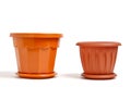 Two brown plastic empty flower pots white background Royalty Free Stock Photo