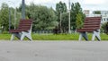 Two wooden benches in a public Park