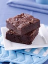 Two brownies stacked on a plate. Royalty Free Stock Photo