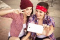 Two Brunette teenage girls friends in hipster outfit jeans shor Royalty Free Stock Photo
