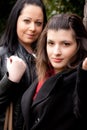 Two brunettes with black clothes