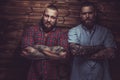 Two brutal mans with beards and tattooes. Royalty Free Stock Photo