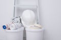 On two buckets are tools and masking tape, against the background of the wall for painting Royalty Free Stock Photo
