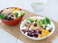 Two Buddha bowls with vegetables, healthy grains, and protein.  Healthy vegetarian salad with buckwheat porridge, corn, avocado Royalty Free Stock Photo