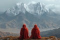 two Buddhist monks against the backdrop of mountains Royalty Free Stock Photo