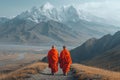 two Buddhist monks against the backdrop of mountains Royalty Free Stock Photo