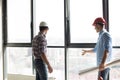 Two builders are checking the panorama windows