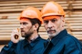 two builders in helmets working outside Royalty Free Stock Photo