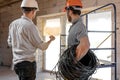 Two builders look at the drawing of the object Royalty Free Stock Photo
