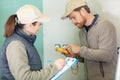 two builders working on building project Royalty Free Stock Photo