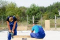 Two builders working on a building site Royalty Free Stock Photo