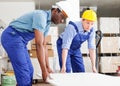 Two builders working indoors Royalty Free Stock Photo