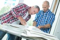Two builders working inside property Royalty Free Stock Photo