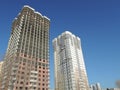 Two buildings rising upon a blue sky. Russia, Saratov - November, 2019 Royalty Free Stock Photo