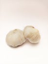 Two bulbs of garlic, two heads of garlic on isolated white background, fresh raw unpeeled bulbs of garlic Royalty Free Stock Photo