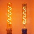 Two bulbs with a vintage glowing spiral of warm light
