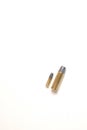 Two bullets of different caliber, one is a .22, the other a .44 Magnum heavyweight. Royalty Free Stock Photo