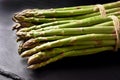 Two bunches of fresh green asparagus on black background Royalty Free Stock Photo
