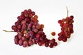 Two Bunches of fresh wine pink grapes falling isolated on a white background Royalty Free Stock Photo