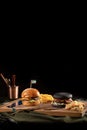 Two burgers black and standart with meat and sesame with fry potato served on woodan board