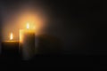 Two burning brightly candles in the dark shadow, space for text romantic colorful concept background Royalty Free Stock Photo