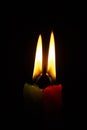 Two burning candles on a black background Royalty Free Stock Photo