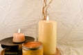 Two burning candles on wooden tabel and white background Royalty Free Stock Photo