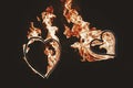 Two burning hearts for wedding couple, amazing fire show at nigh