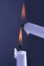 Two burning white candles on a blue background Royalty Free Stock Photo