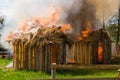 Two burning wooden buildings