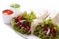 Two burritos with meat and vegetables and sauce Royalty Free Stock Photo
