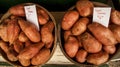 Two bushels of sweet potatoes for sale Royalty Free Stock Photo