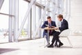 Two business colleagues at meeting in modern office interior