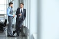 Two business colleagues at meeting in modern office interior. Royalty Free Stock Photo