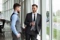 Two business colleagues at meeting in modern office interior. Royalty Free Stock Photo