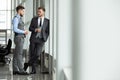 Two business colleagues at meeting in modern office interior. Royalty Free Stock Photo