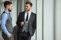 Two business colleagues at meeting in modern office interior. Royalty Free Stock Photo