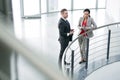 Two Business Colleagues Talking at Balcony Royalty Free Stock Photo