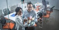 Two business colleagues writing something on sticky notes on glass door in modern meeting room. Royalty Free Stock Photo