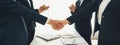 Two business executive shake hand in boardroom for merger and acquisition. Shrewd Royalty Free Stock Photo