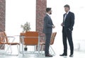 Two business executives talking about business in the office. Royalty Free Stock Photo