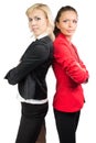 Two business lady standing back-to-back Royalty Free Stock Photo