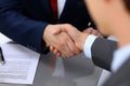 Two business man shaking hands to each other above signed contract Royalty Free Stock Photo